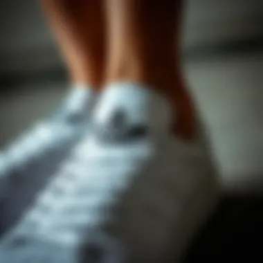 Close-up of Adidas white shoe detailing showcasing craftsmanship