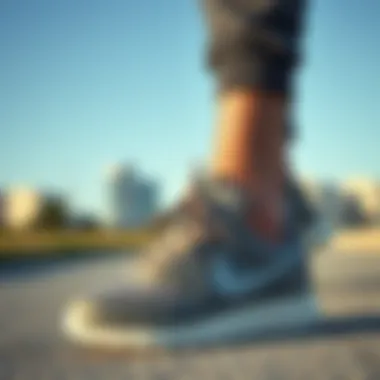 Nike Grey Footwear with Trendy Sportswear Nike grey footwear paired with trendy sportswear